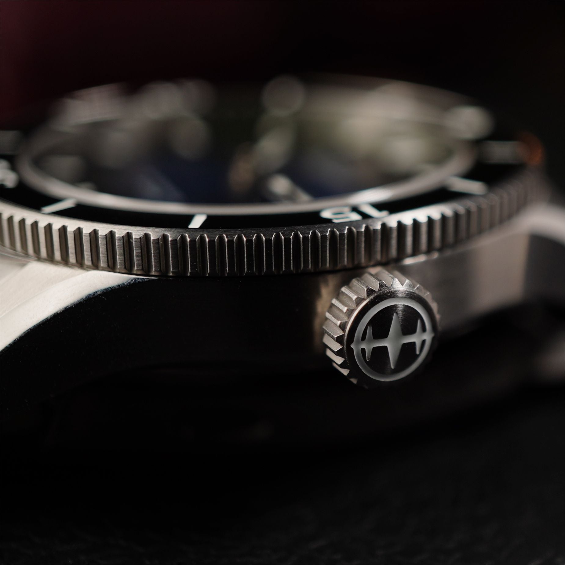 Close up of premium dive watch crown, signed with Houtman logo