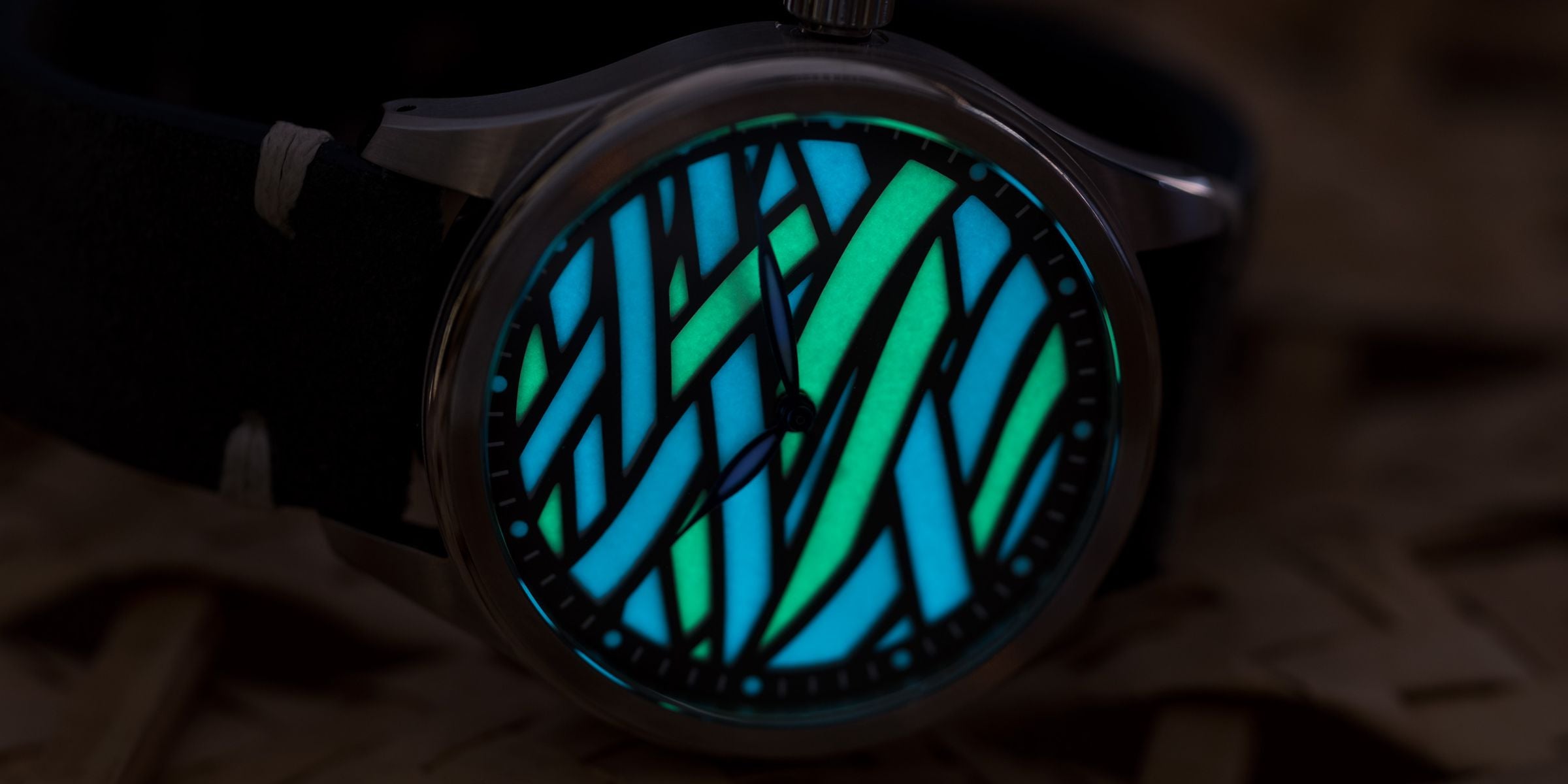 watch dial glowing like a stained window