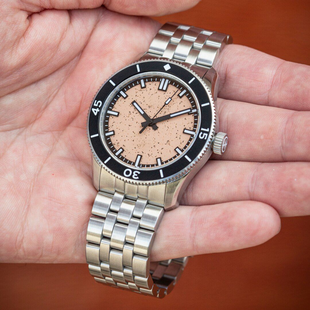 Watch with salmon colour compressed rock dial and no branding