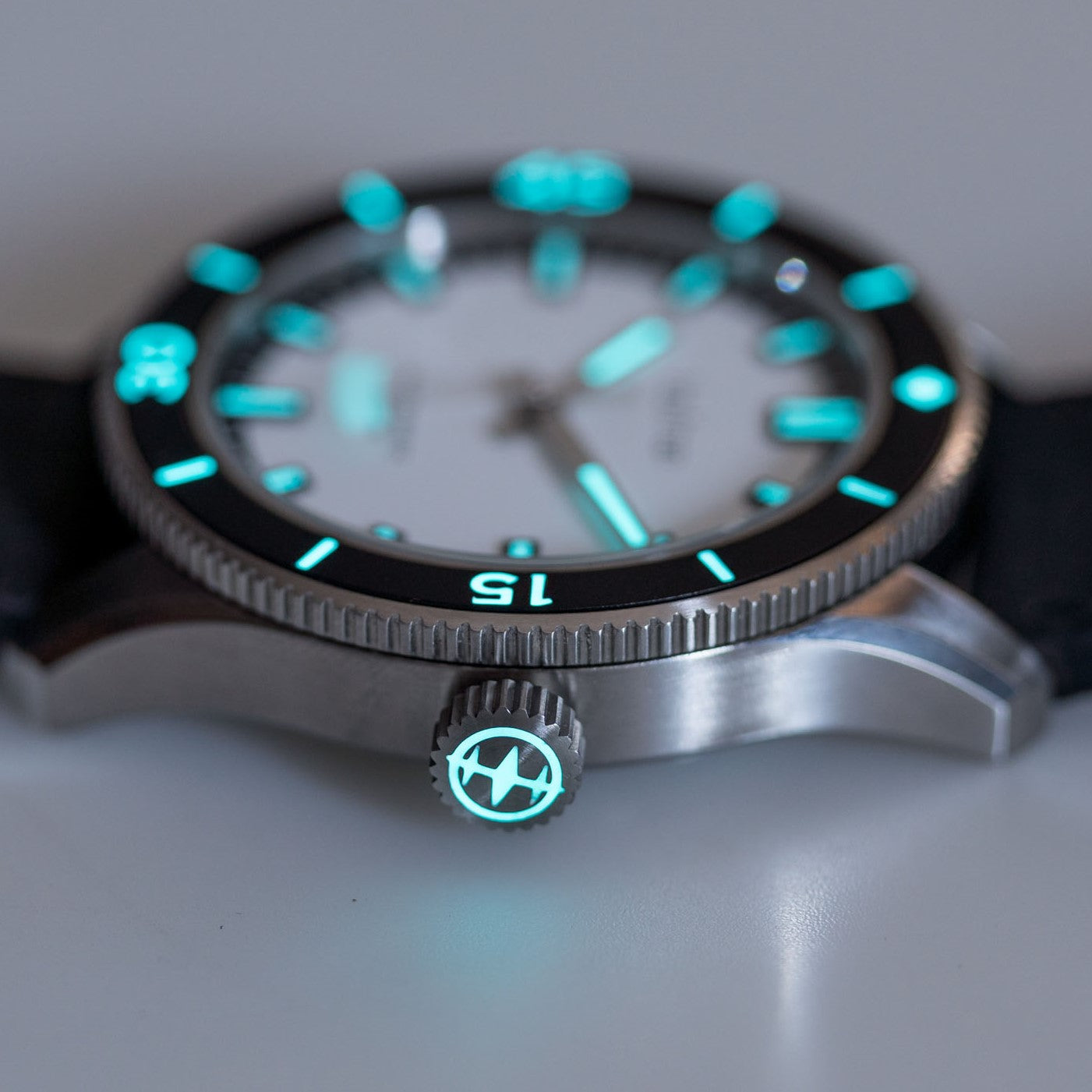 White dial dive watch with Swiss BGW9 luminous markers. Glowing dial markers and bezel insert markers. 